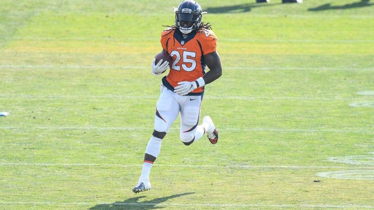 Running back Melvin Gordon #25 of the Denver Broncos participates in a drill during a training session
