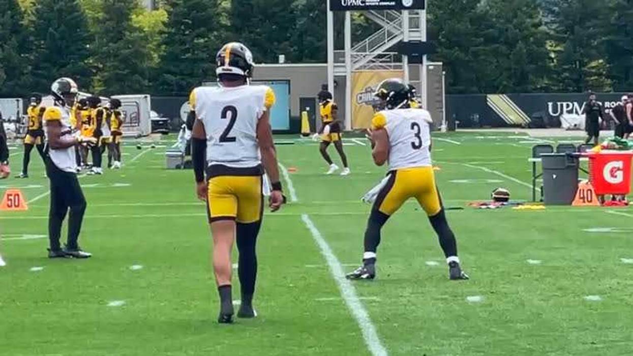 Russell Wilson and Justin Fields at practice