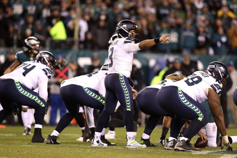 Russell Wilson commands the huddle