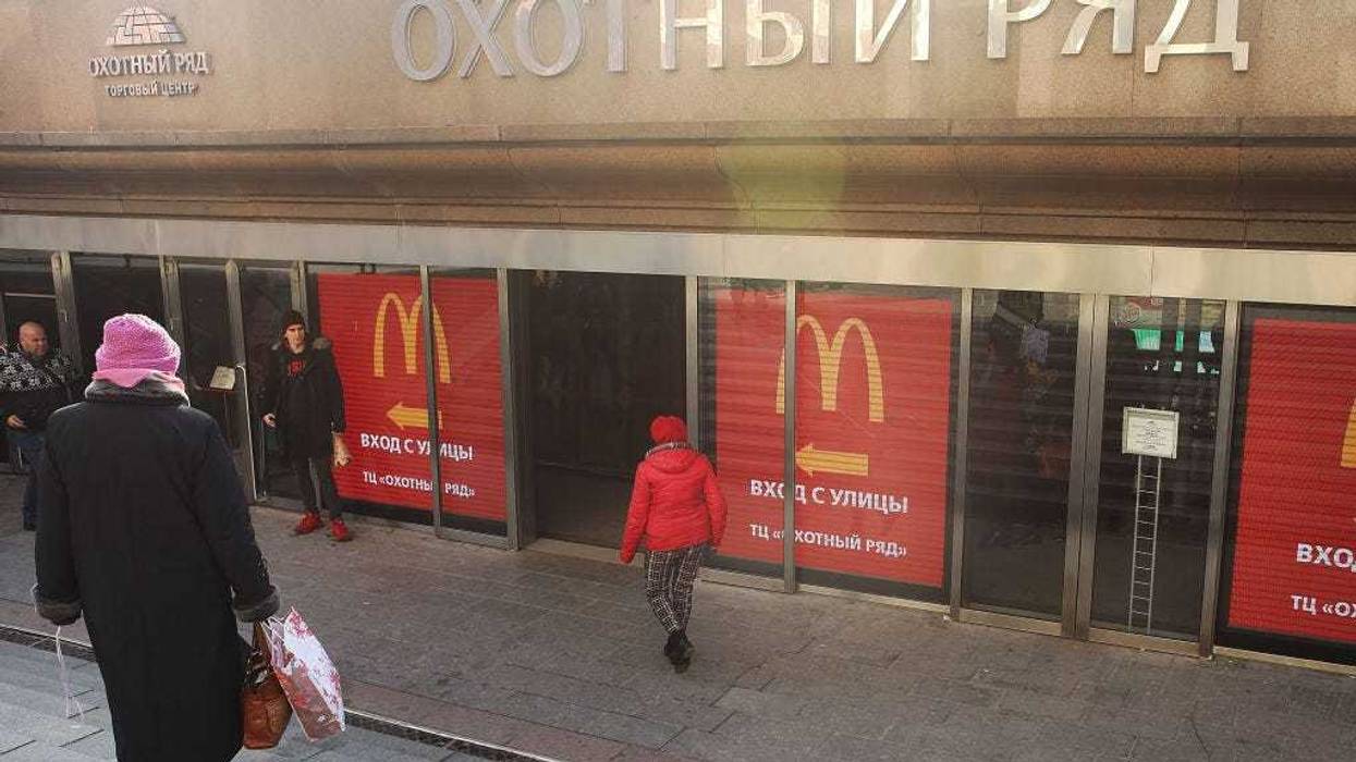 Russians walk into a McDonald's restaurant in Moscow on March 7, 2017 in Moscow, Russia.