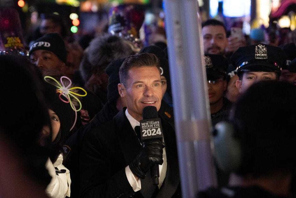 Ryan Seacrest talks on camera during New Year