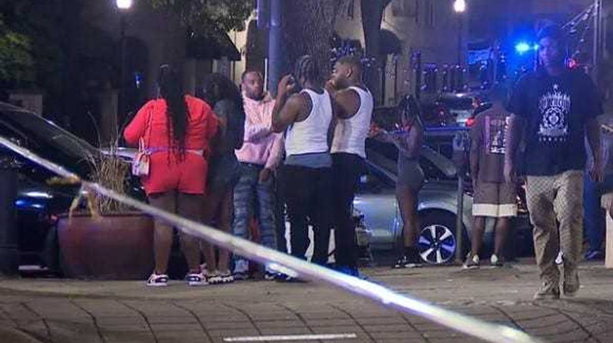 s bystanders near the scene of a shooting
