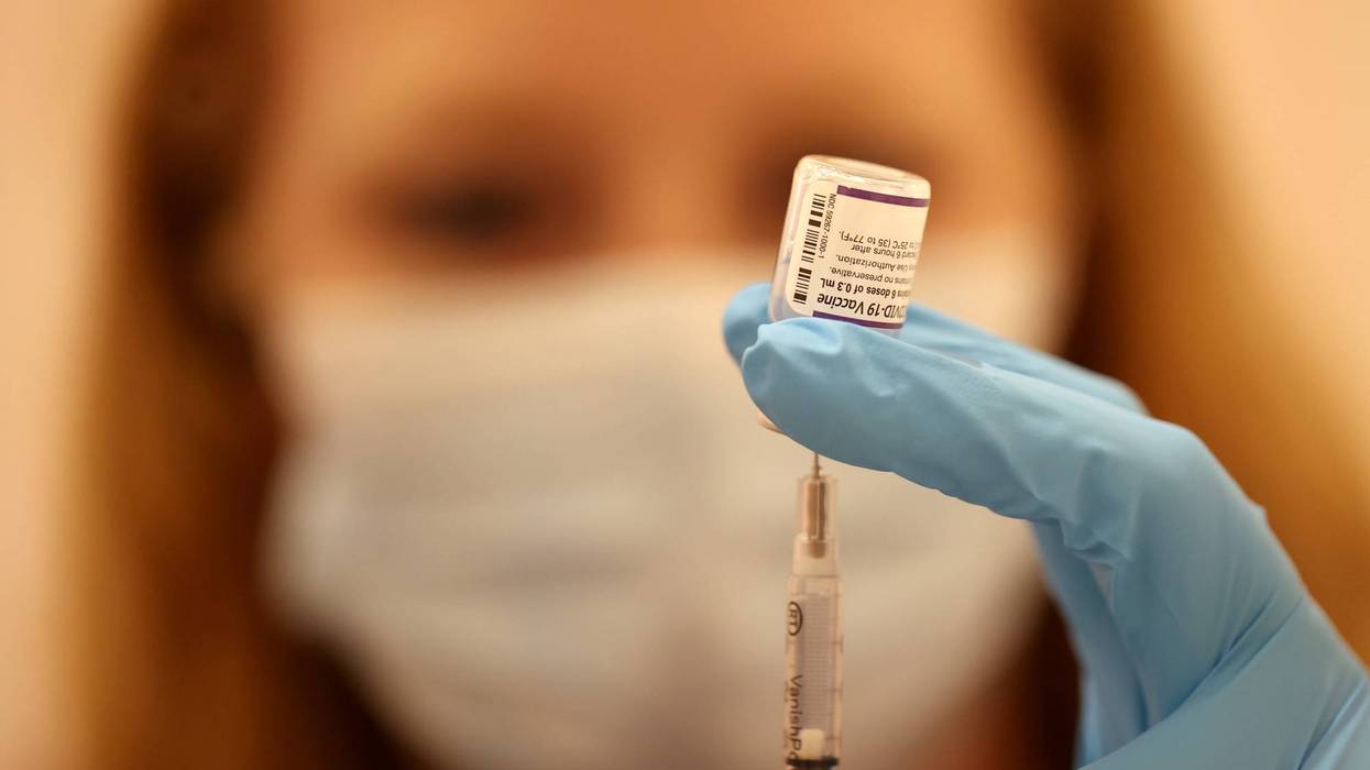 Safeway pharmacist Ashley McGee fills a syringe with the Pfizer COVID-19 booster vaccination at a vaccination booster shot clinic on October 01, 2021 in San Rafael, California.