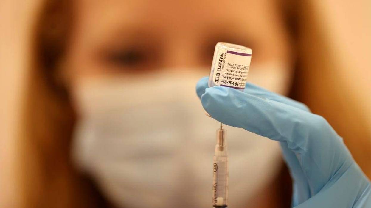 Safeway pharmacist Ashley McGee fills a syringe with the Pfizer COVID-19 booster vaccination at a vaccination booster shot clinic on October 01, 2021 in San Rafael, California.