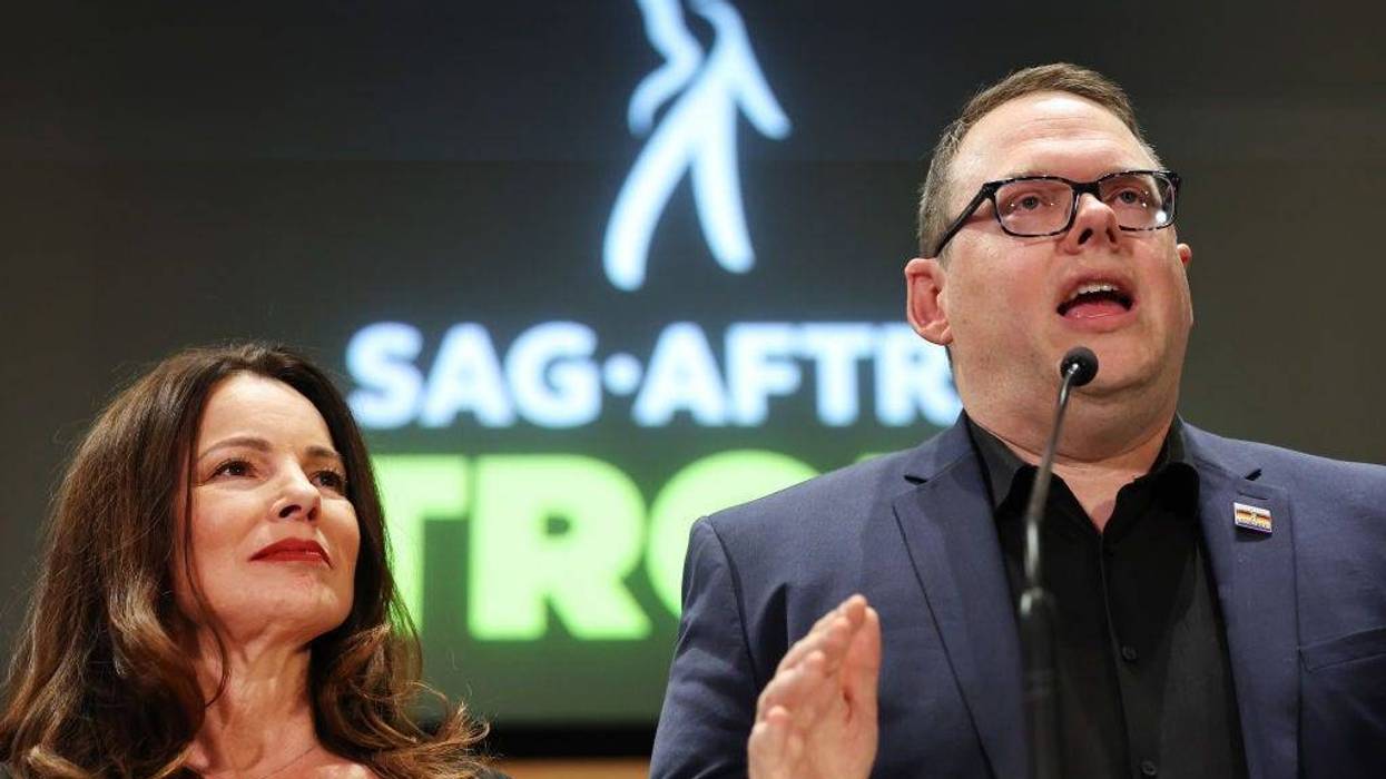 SAG-AFTRA President Fran Drescher (L) looks on as SAG-AFTRA National Executive Director Duncan Crabtree-Ireland speaks at a press conference discussing their strike-ending deal with the Hollywood studios on November 10, 2023 in Los Angeles, California.