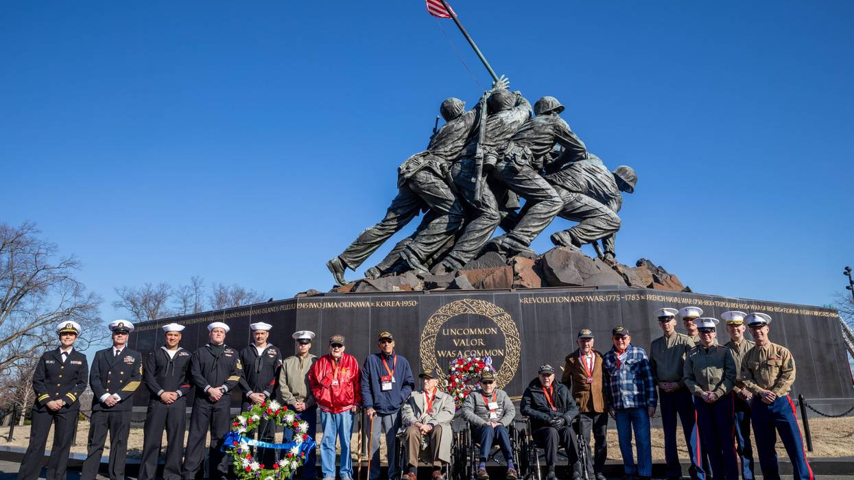 Sailors assigned to the Wasp-class amphibious assault ship USS Iwo Jima (LHD 7) pose for photos with surviving veterans from the Battle of Iwo Jima during the 80th Anniversary Commemoration of the Battle of Iwo Jima. Iwo Jima is the second amphibious assault ship to bear the battle's namesake