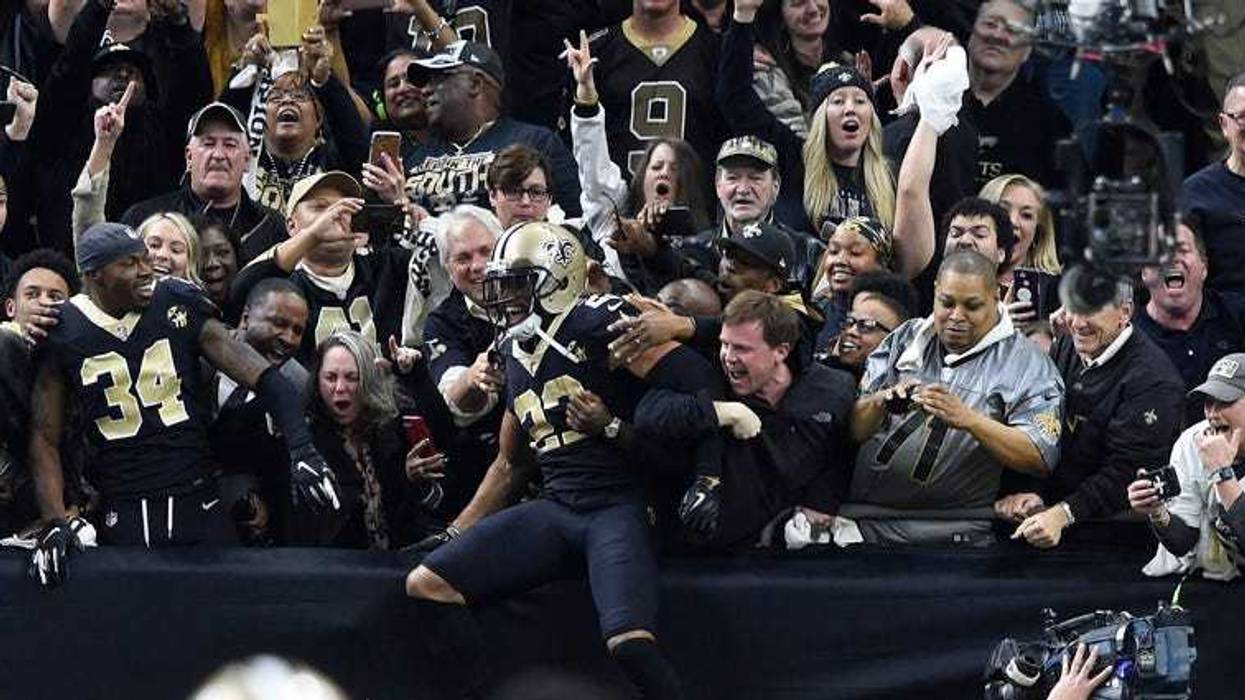 Saints cornerback Marshon Lattimore celebrates with fans after intercepting a pass against the Philadelphia Eagles during the fourth quarter of an NFC divisional playoff game on Jan. 13, 2019, at the Mercedes-Benz Superdome in New Orleans.
