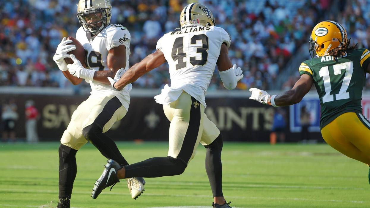 Saints cornerback Paulson Adebo intercepts Aaron Rodgers