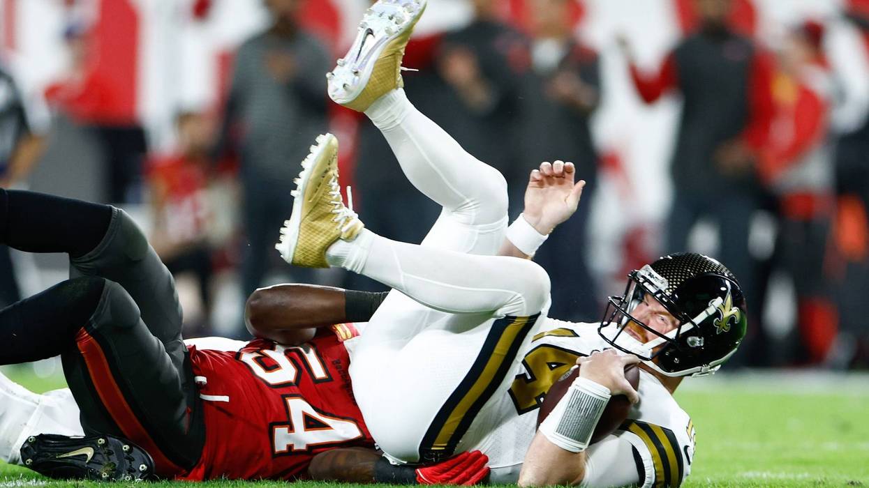 Saints quarterback Andy Dalton on the ground