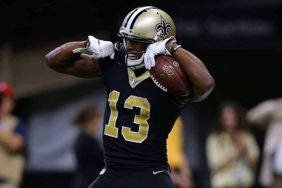 Saints receiver Michael Thomas flexes after scoring a touchdown