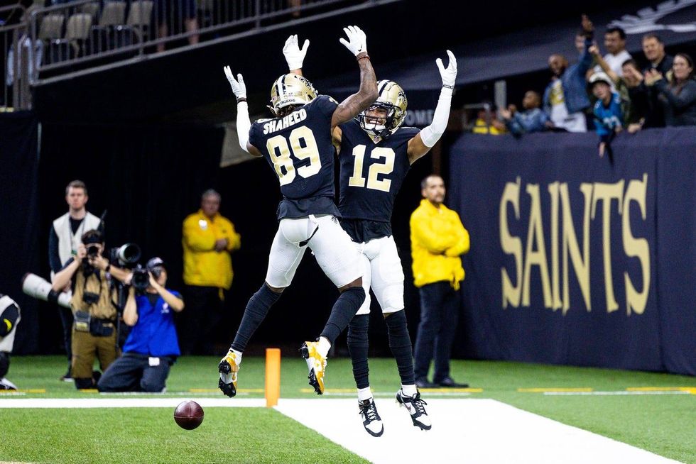 Saints WRs Chris Olave and Rashid Shaheed celebrate after a TD.