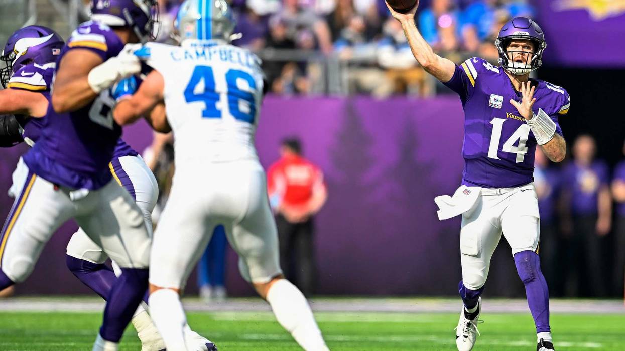 Sam Darnold #14 of the Minnesota Vikings throws a pass in the second quarter of a game against the Detroit Lions at U.S. Bank Stadium on October 20, 2024 in Minneapolis, Minnesota.