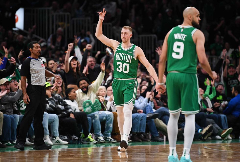 Sam Hauser #30 of the Boston Celtics celebrates a three point shot against the Utah Jazz during the second half at TD Garden on March 10, 2025 in Boston, Massachusetts.