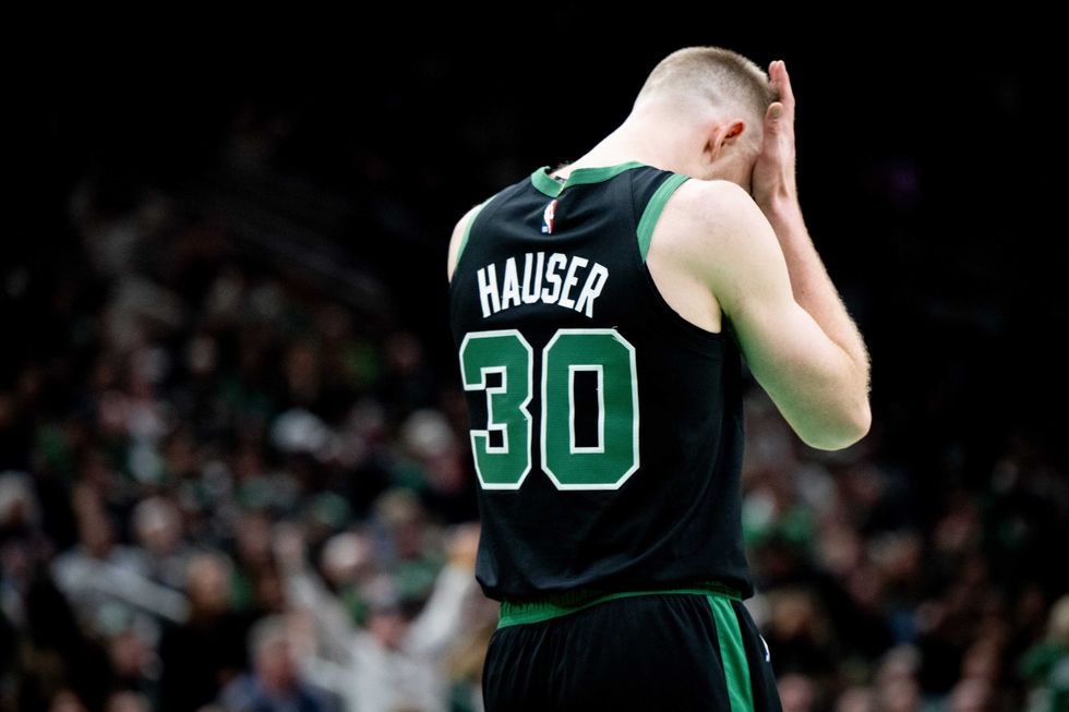 Sam Hauser #30 of the Boston Celtics react during the second half against the Atlanta Hawks at TD Garden on January 18, 2025 in Boston, Massachusetts.