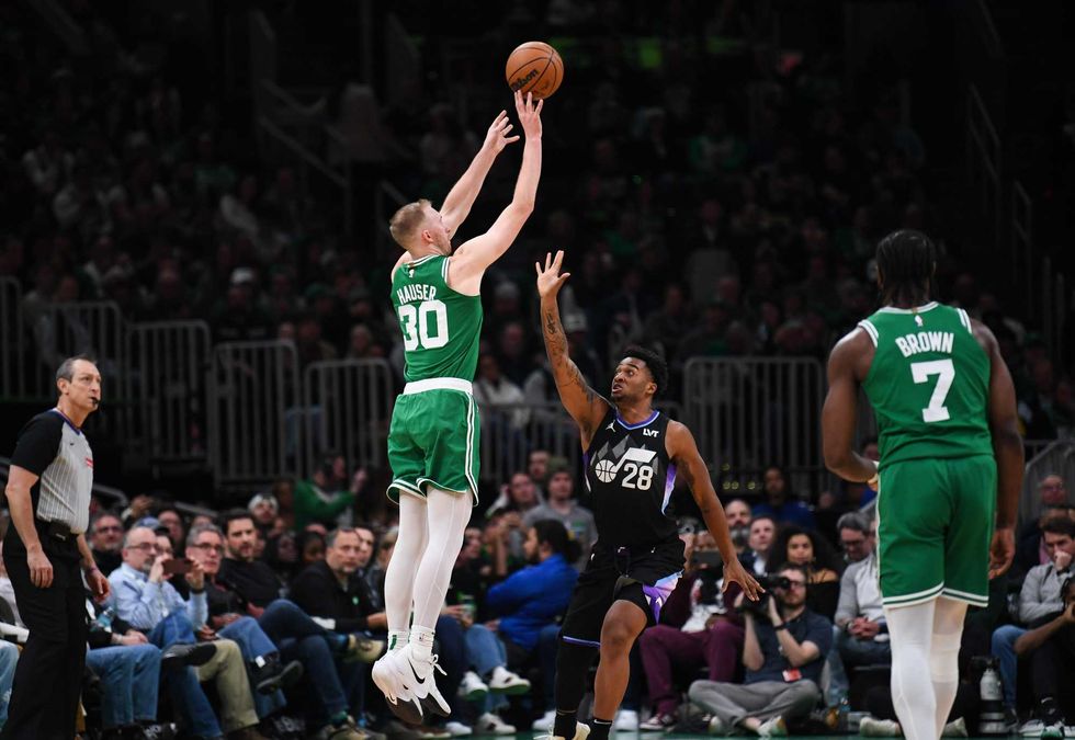 Sam Hauser #30 of the Boston Celtics shoots the ball against Brice Sensabaugh #28 of the Utah Jazz during the second half at TD Garden on March 10, 2025 in Boston, Massachusetts.