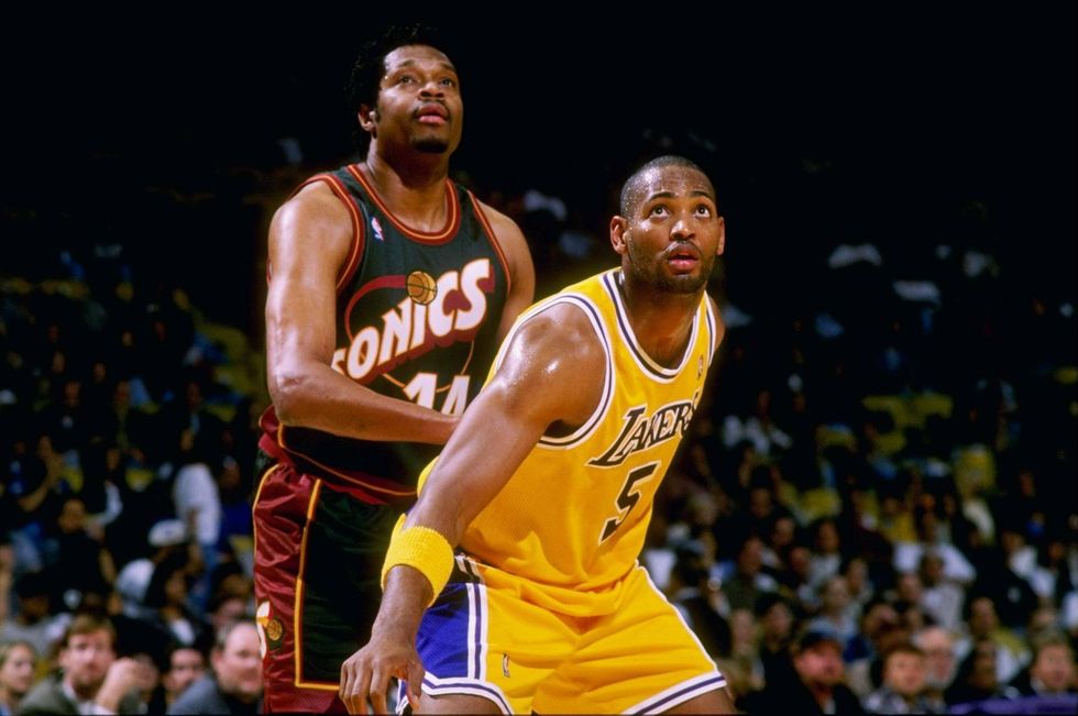 Sam Perkins & Robert Horry 25 Oct 1997: Sam Perkins #14 of the Seattle Supersonics in action against Robert Horry #5 of the Los Angeles Lakers at the Great Western Forum in Inglewood, California. The Los Angeles Lakers beat the Seattle Supersonics 85-79.