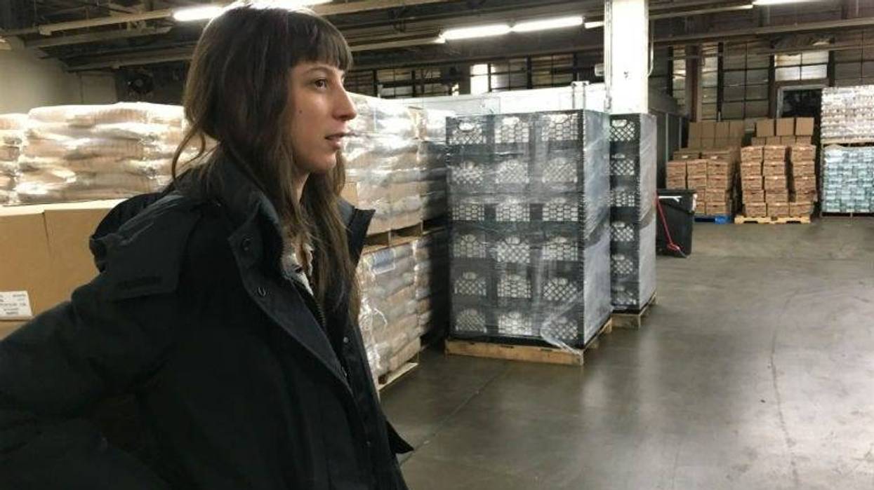 Samantha Mogil, manager of government and community affairs for Share Food Program, says in the organization's warehouse that the nonprofit will provide free food for furloughed workers.