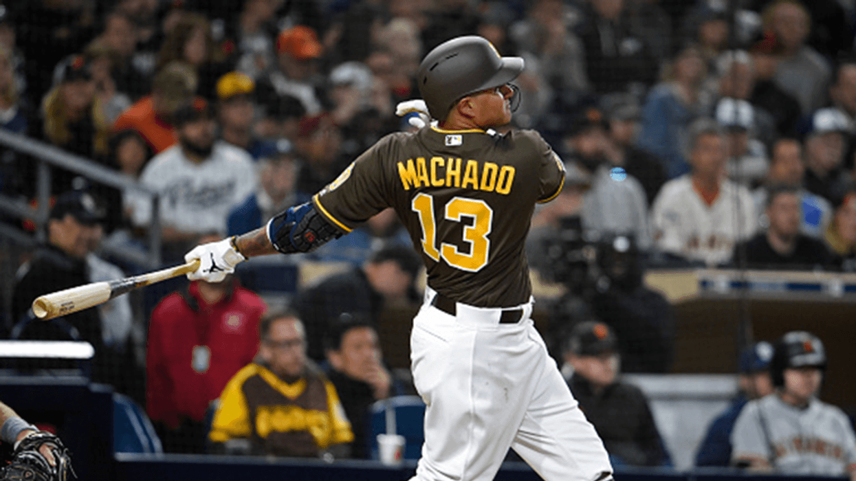 SAN DIEGO, CA - MARCH 29: Manny Machado #13 of the San Diego Padres hits a single during the fifth inning against the San Francisco Giants at Petco Park March 29, 2019 in San Diego, California. (Photo by Denis Poroy/Getty Images)