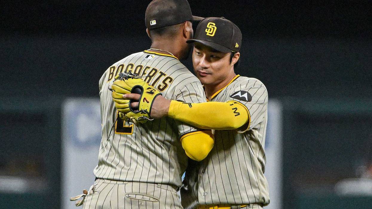 San Diego Padres second baseman Ha-Seong Kim (7) and shortstop Xander Bogaerts (2) celebrate after the Padres defeated the St. Louis Cardinals at Busch Stadium