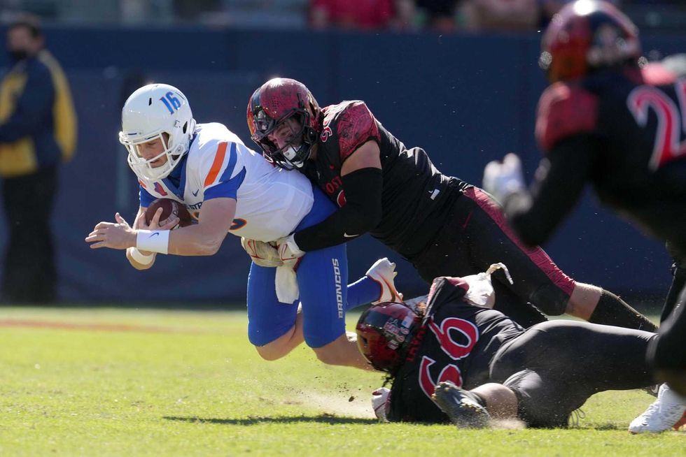 San Diego State Aztecs defensive lineman Cameron Thomas (99) tackles Boise State Broncos quarterback Jack Sears (16) in the second half at Dignity Health Sports Park. San Diego State defeated Boise State 27-16.