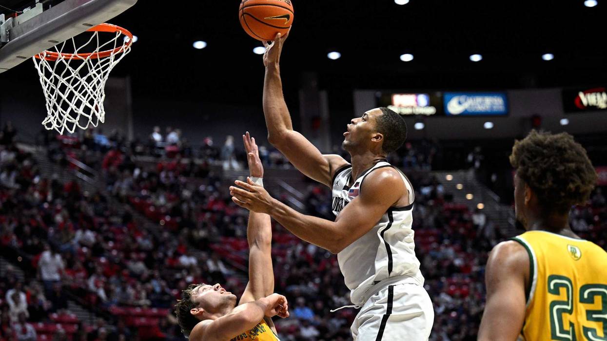 San Diego State Aztecs player Jaedon LeDee rises to the basket for a shot against Point Loma Nazarene.