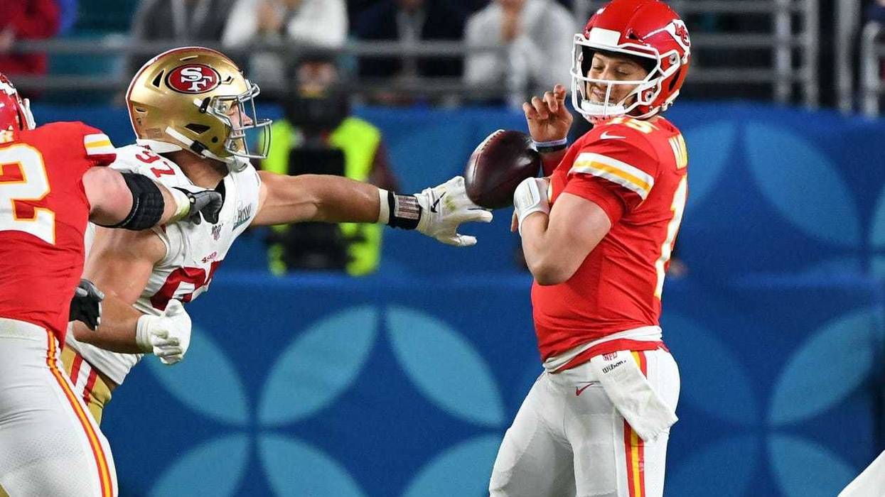 San Francisco 49ers defensive end Nick Bosa (97) knocks the ball out of Kansas City Chiefs quarterback Patrick Mahomes (15) hands during the third quarter in Super Bowl LIV at Hard Rock Stadium.