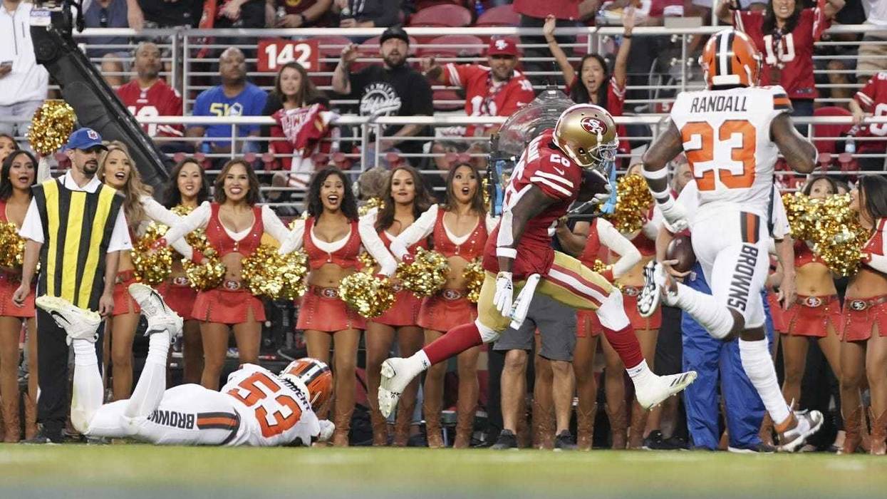 San Francisco 49ers running back Tevin Coleman (26) scores a touchdown against Cleveland Browns middle linebacker Joe Schobert (53) and strong safety Damarious Randall (23) during the second quarter at Levi s Stadium.