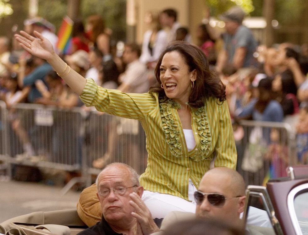 San Francisco District Attorney Kamala Harris, top, waves to the crowd during the annual Gay Pride Parade along Market Street on Sunday, June 28, 2009 in San Francisco, California.