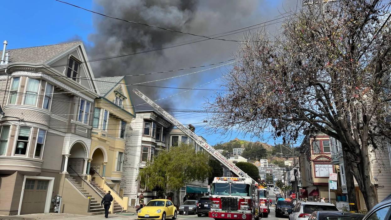 San Francisco Fire Department crews battle flames at 112 Eureka St. on Friday afternoon.