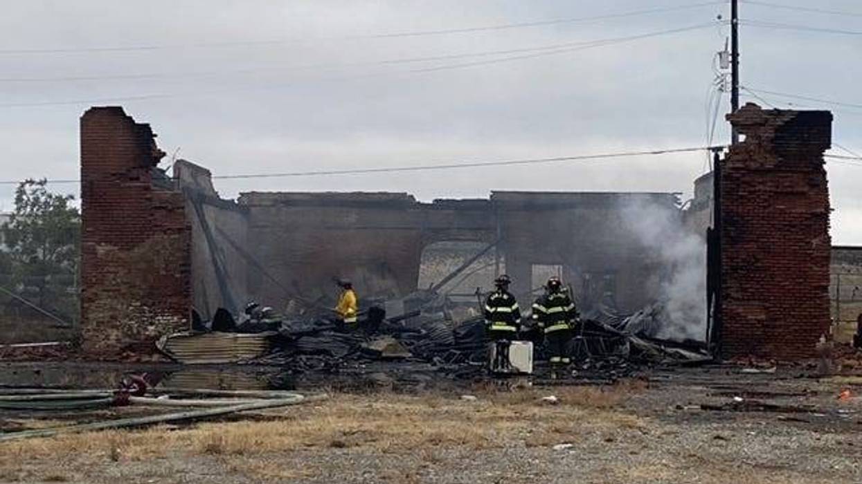 San Jose firefighters survey the wreckage after putting out the flames at a historical building.