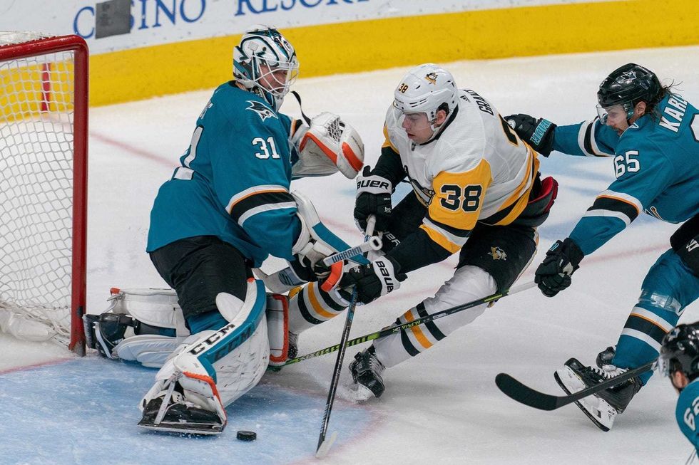 San Jose Sharks goaltender Martin Jones (31) makes a save against Pittsburgh Penguins center Derek Grant (38) during the third period the at SAP Center at San Jose.