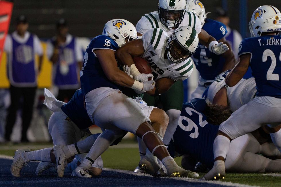 San Jose State Spartans defensive lineman Viliami Fehoko (42) tackles Portland State Vikings running back Andrew Van Buren (21) during the fourth quarter at CEFCU Stadium.