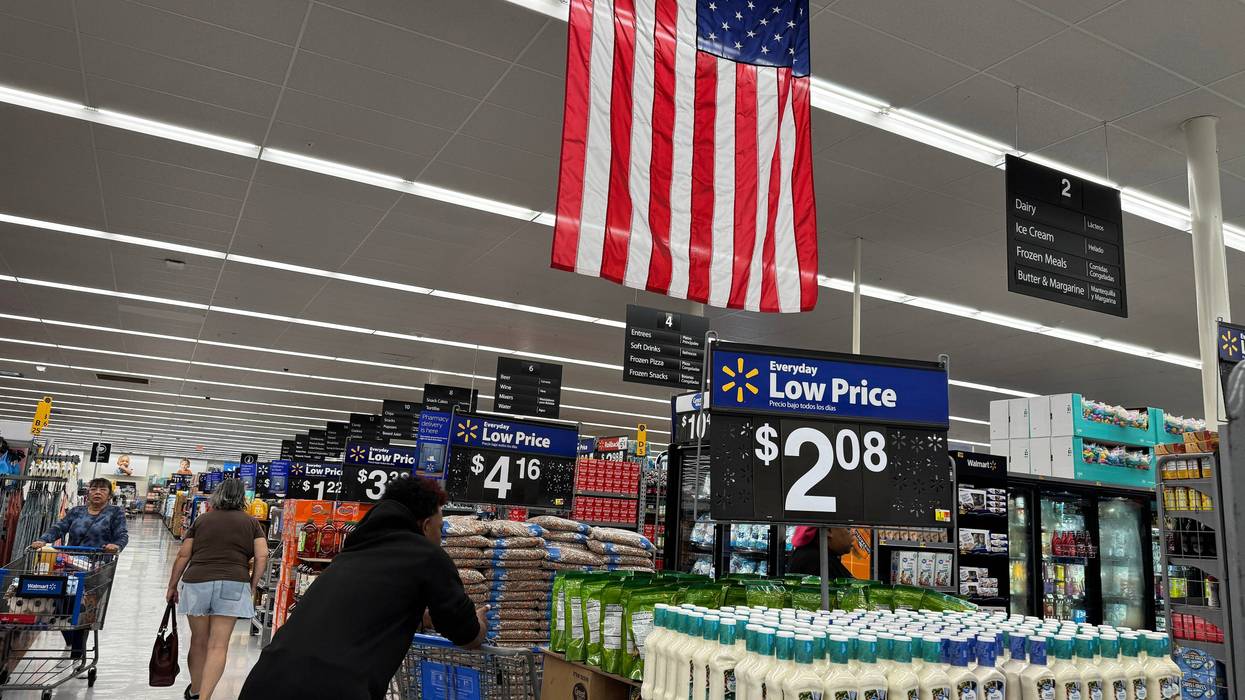 SAN LEANDRO, CALIFORNIA - APRIL 09: A customer shops at a Walmart store on April 09, 2025 in San Leandro, California. Walmart is pulling its first-quarter earnings estimates as President Donald Trump’s new tariffs could impact its profits in the first quarter. (Photo by Justin Sullivan/Getty Images)