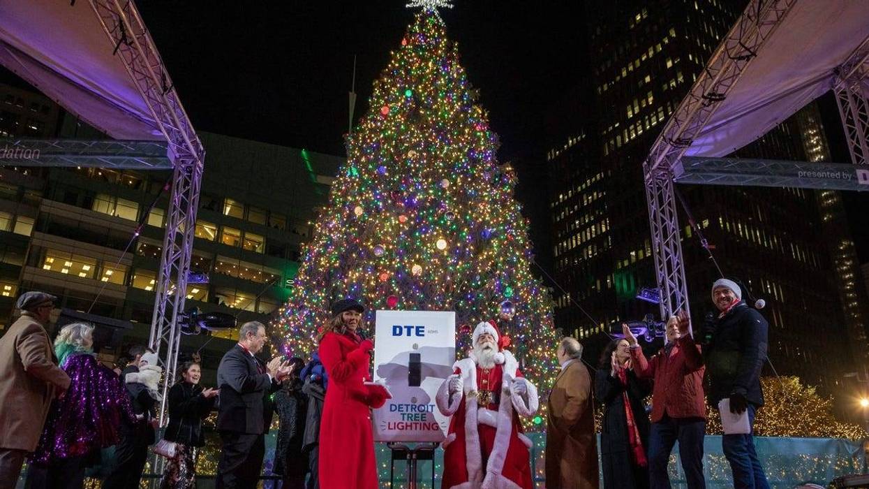 Santa Claus, Mayor Mike Duggan and others stand on stage during the 20th Annual Tree Lighting in downtown Detroit o