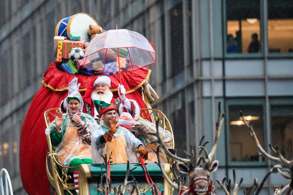 Santa Claus waves to the crowds during the Annual Thanksgiving Day Parade on November 28, 2024 in New York City.