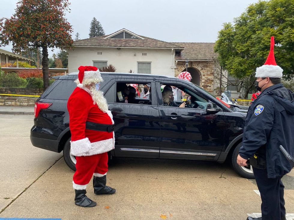 Santa Cruz police officers give away toys to kids in need.