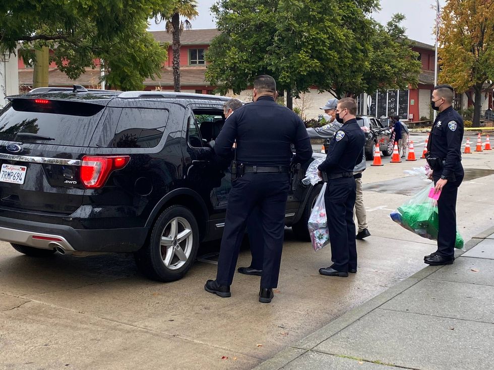 Santa Cruz police officers hand out kids to toys in need this holiday season.