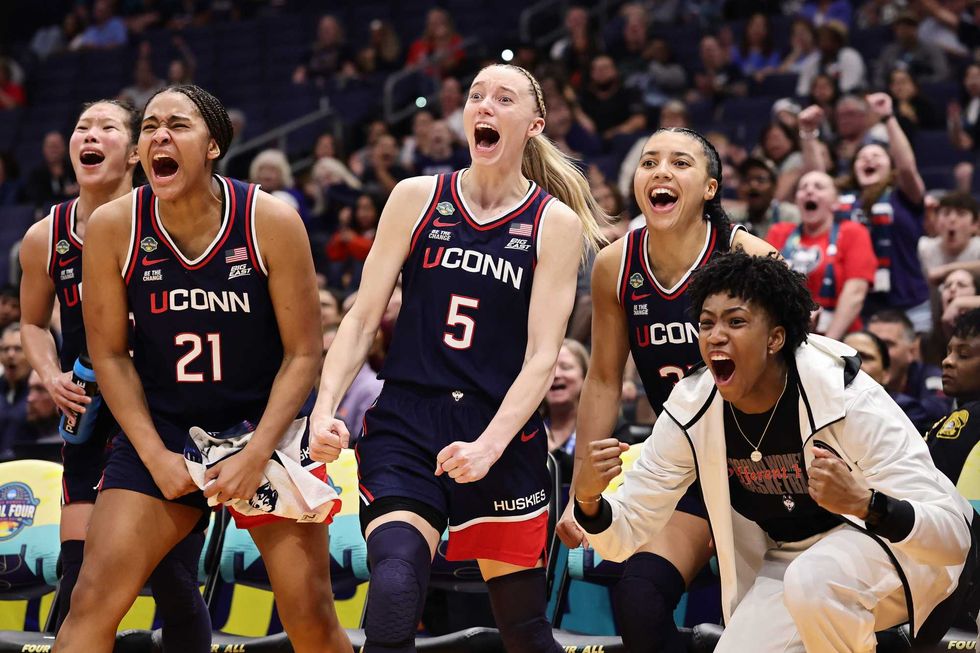 Sarah Strong #21 and Paige Bueckers #5 and Ayanna Patterson #34 of the UConn Huskies celebrate in the fourth quarter against the UCLA Bruins in the Final Four game of the NCAA Women