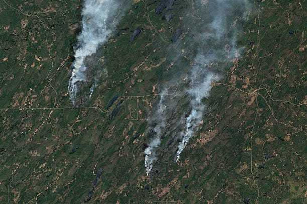 Satellite view of the Jenkins Creek Fire and Camp House Fire raging across St. Louis County, Minnesota in May 2025.