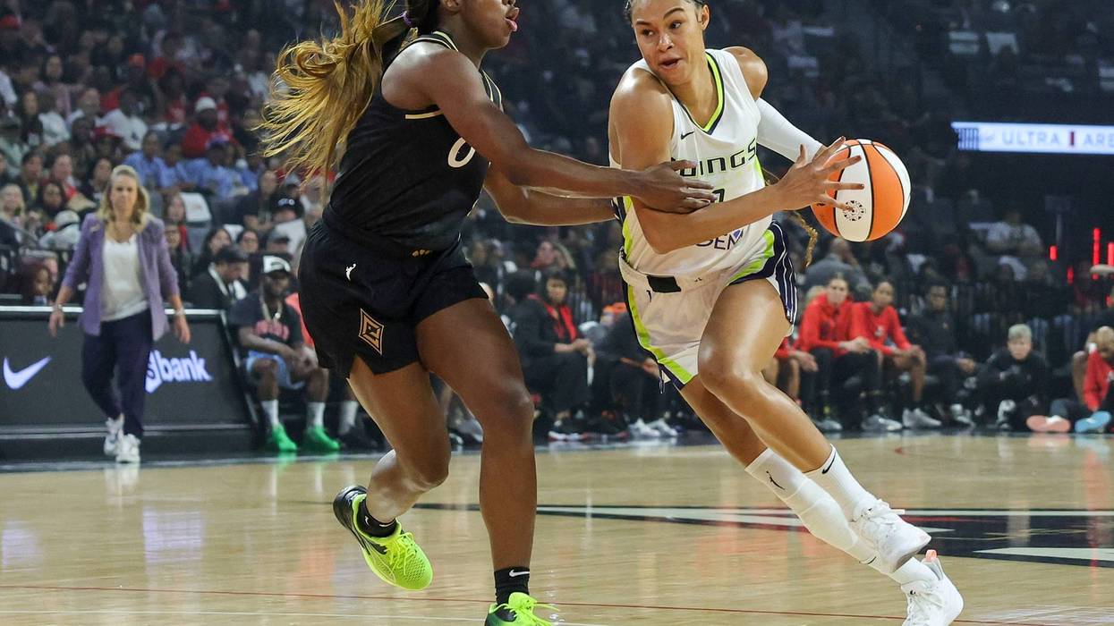 Satou Sabally #0 of the Dallas Wings drives against Jackie Young #0 of the Las Vegas Aces in the first quarter of Game Two of the 2023 WNBA Playoffs semifinals at Michelob ULTRA Arena on September 26, 2023 in Las Vegas, Nevada.