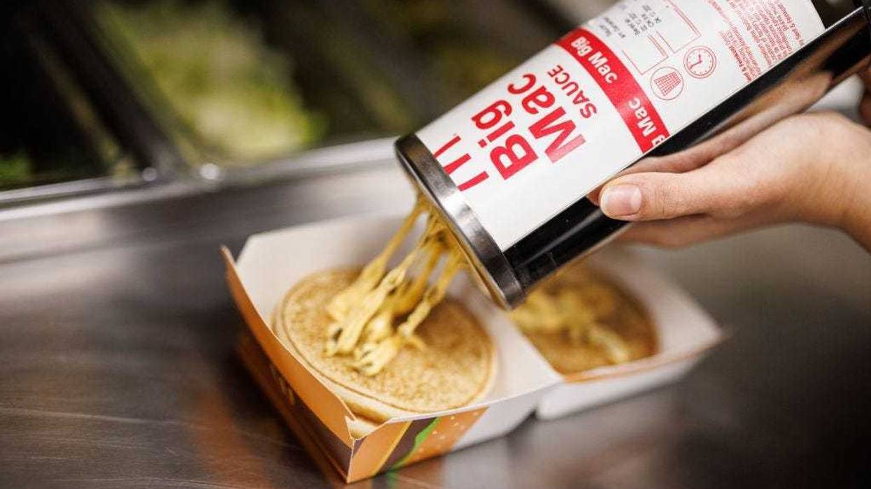 Sauce being applied to Big Mac