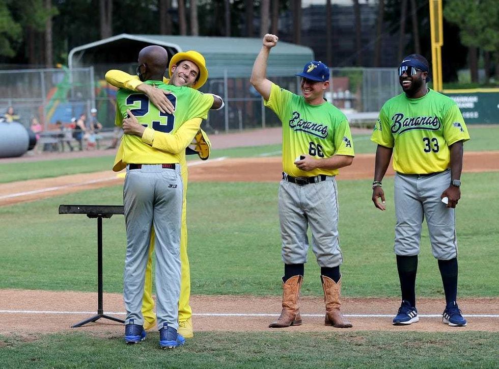 Savannah Bananas owner Jesse Cole hugs Reggie Horton as the team celebrates last year