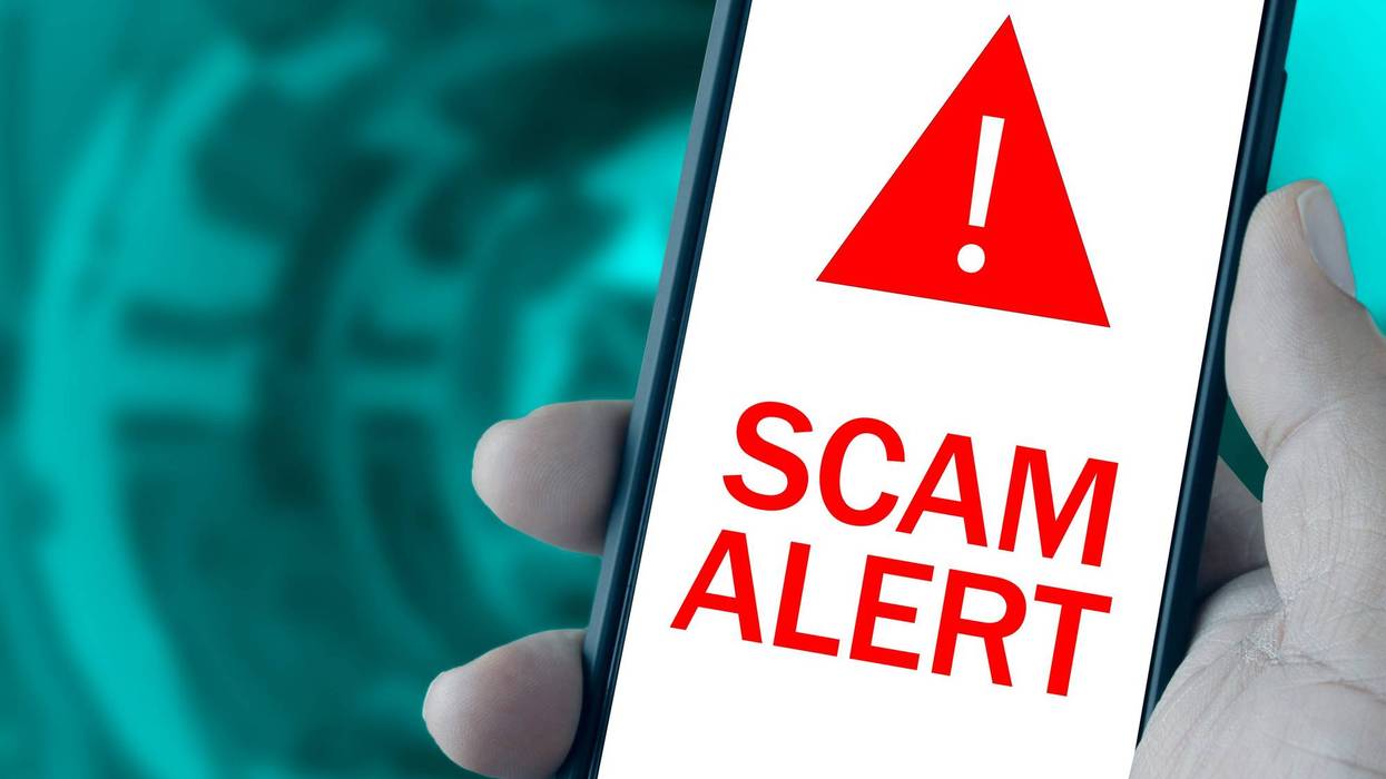 Scam Alert message on smartphone screen