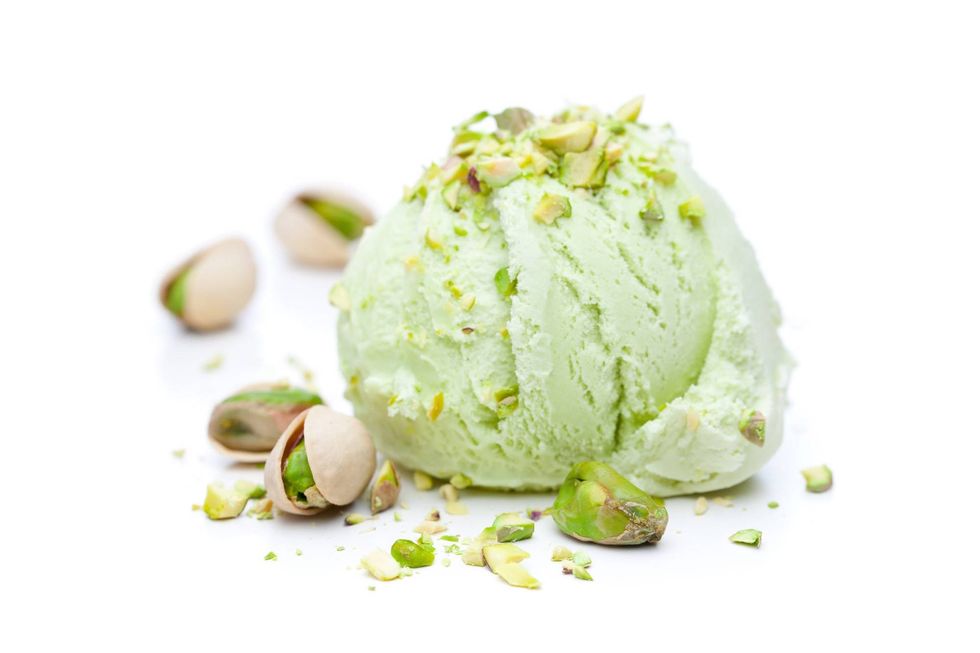scoop of pistachio ice cream with pistachios