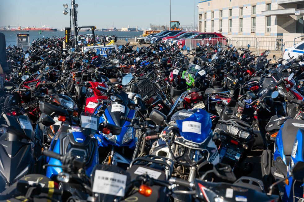 Scooters and motorcycles seized from the streets are stored at a tow yard in Brooklyn on February 5, 2024