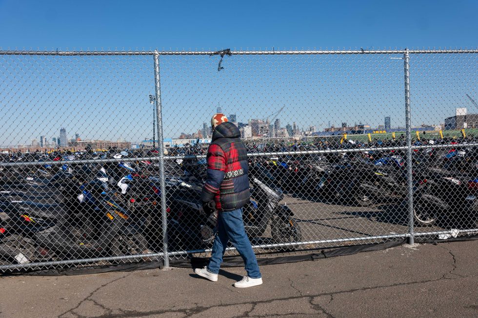 Scooters and motorcycles seized from the streets are stored at a tow yard in Brooklyn on February 5, 2024