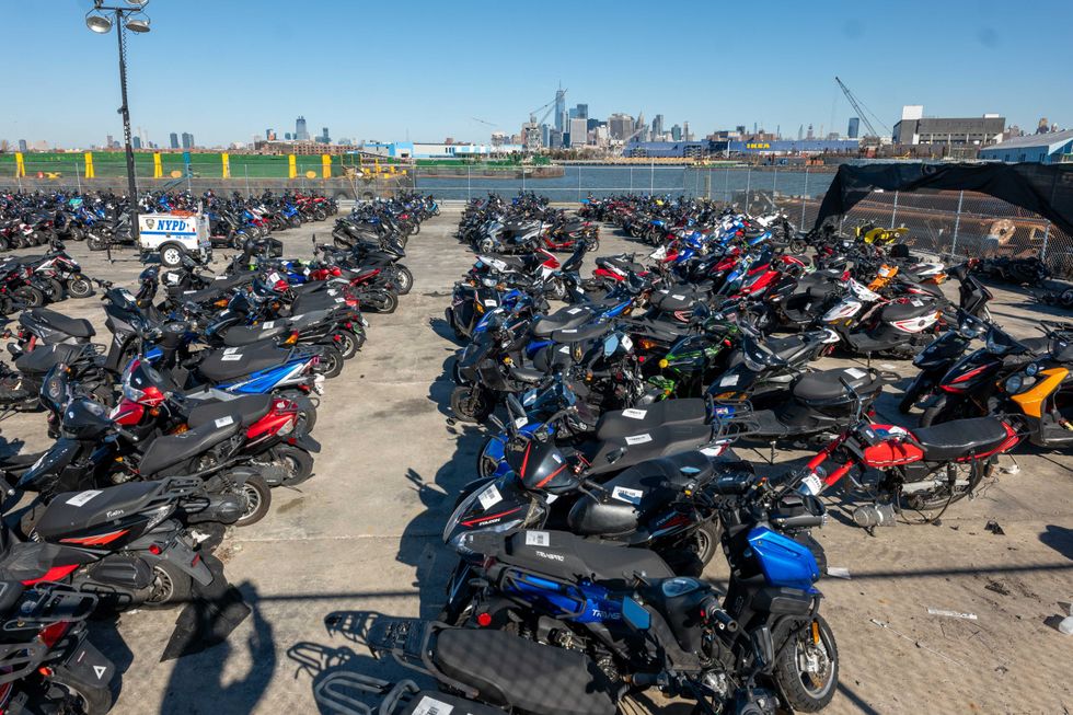 Scooters and motorcycles seized from the streets are stored at a tow yard in Brooklyn on February 5, 2024