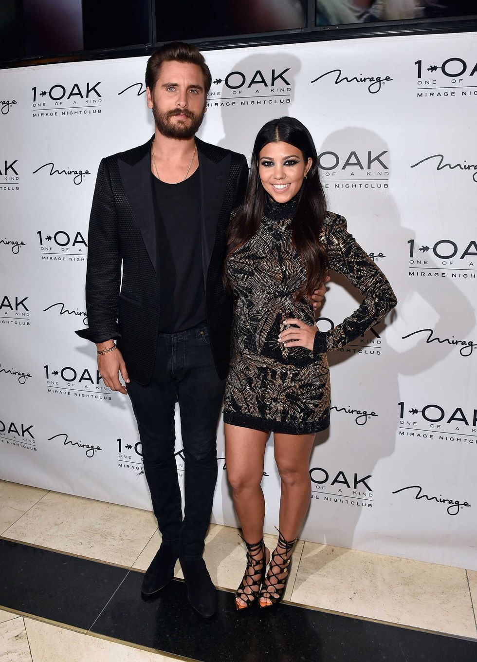 Scott Disick (L) and Kourtney Kardashian arrive at his birthday celebration at 1 OAK Nightclub at The Mirage Hotel & Casino on May 23, 2015 in Las Vegas, Nevada.
