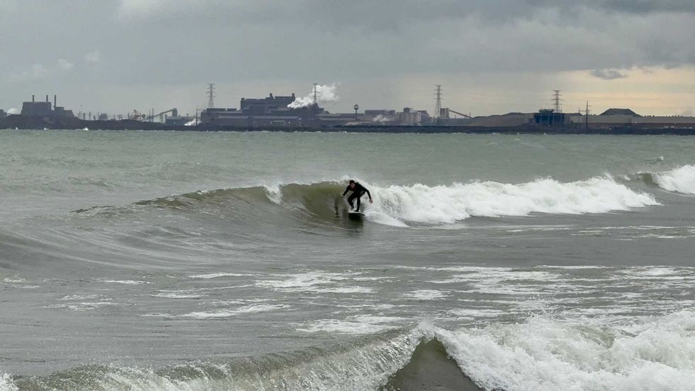 Scott Turner is the founder and owner of Flux Surfboards in Chicago. He hand-shapes and glasses surfboards - start to finish all by himself, and he