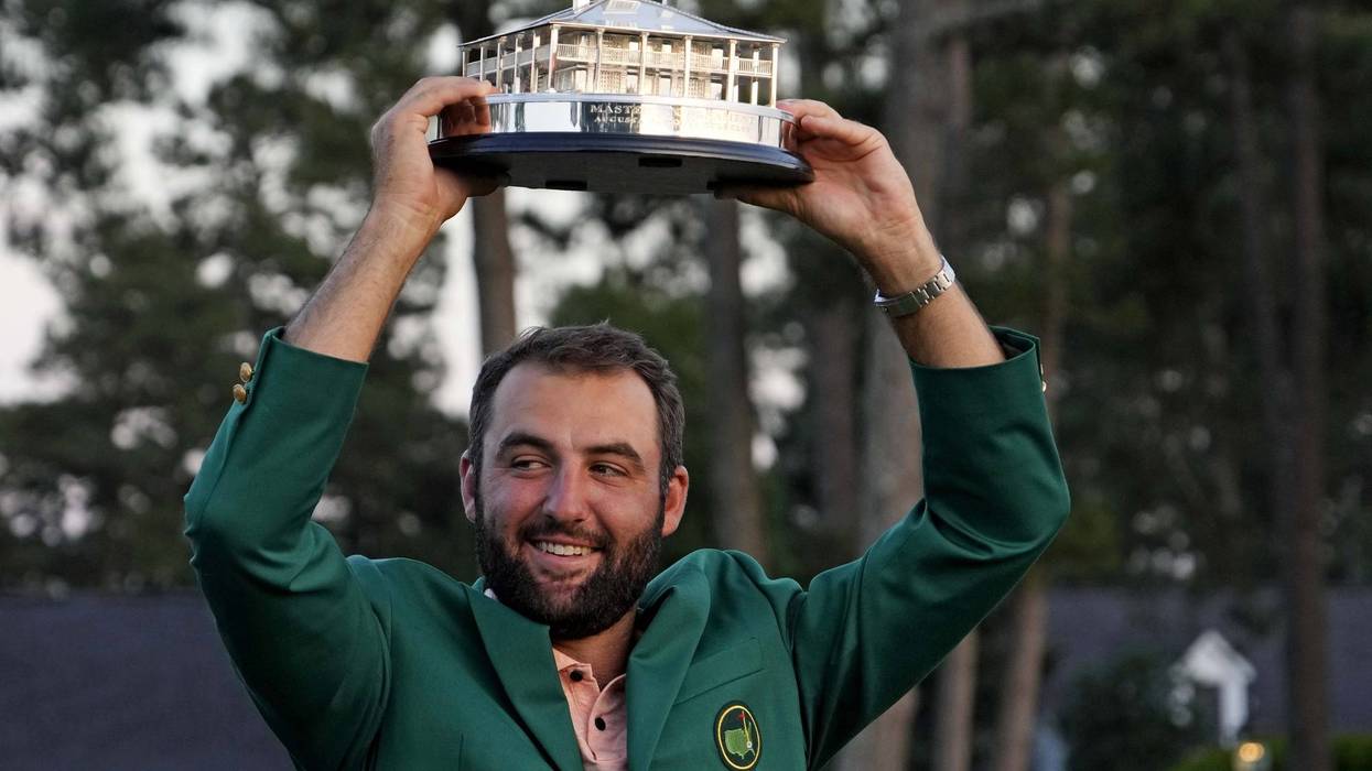 Scottie Scheffler poses with The Master Trophy after the final round of the Masters Tournament.
